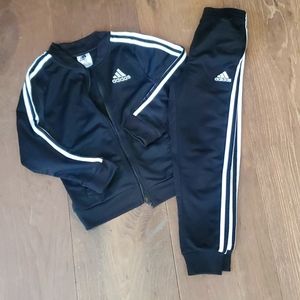 Adidas black track suit.